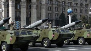 Soldiers salute as they parade on Tochka-U tactical rocket complexes during Ukraine's Independence Day military parade, in the center of Kiev